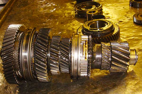 close up view of a gearbox main shaft with almost all the teeth damaged