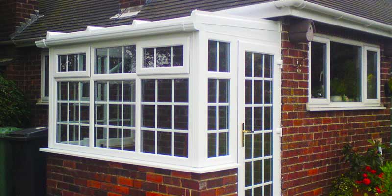 close up capturing all of this small very grand georgian conservatory in white contructed from pvcu