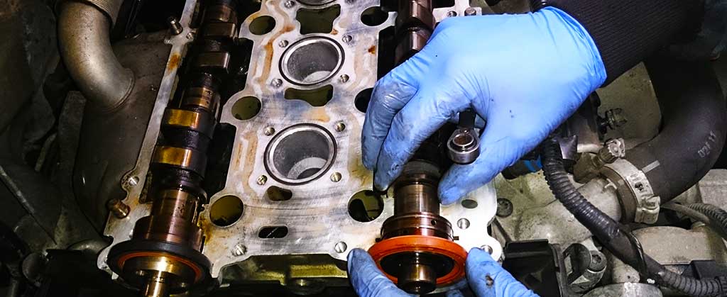 close up of a dismantled car cylinder head ready to be skimmed after the vehicles engine overheated