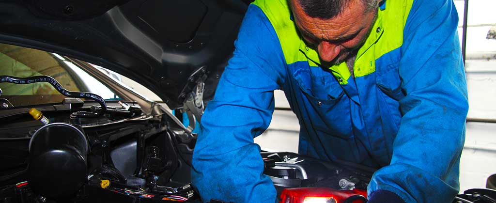 close up of an excel mechanic repairing a car engine problem in their chesterfield garage