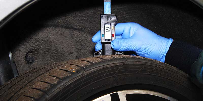 close up view of a worn mercedes car tyre in desperate need of a new tyre